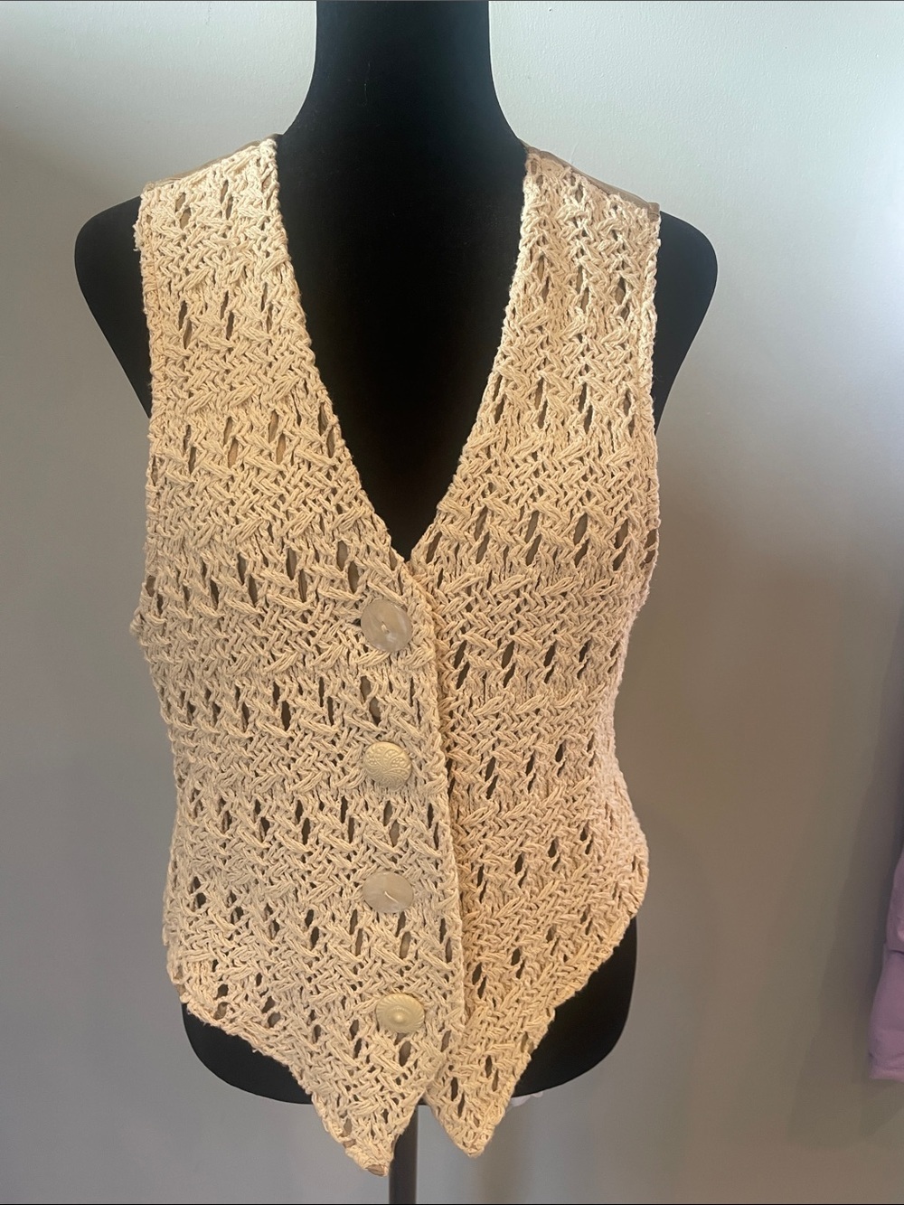 Beige crocheted ladies vest with a boho festival vibe